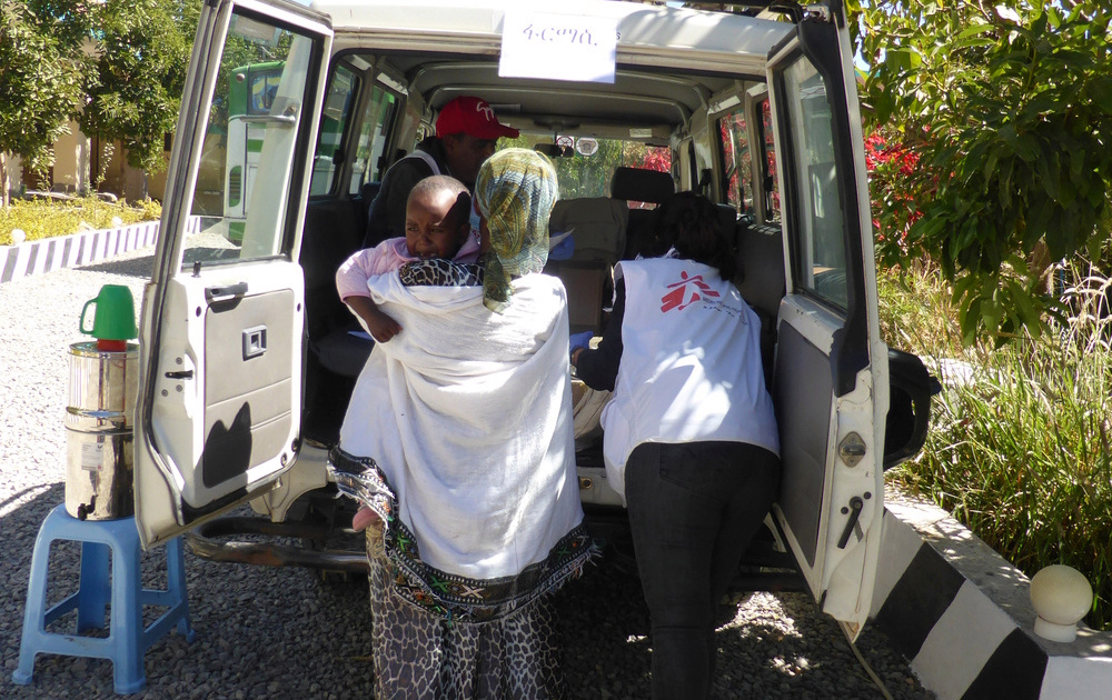 Medecins Sans Frontieres (MSF) team members prepare to transport a patient on a mobile clinic in Hawzen